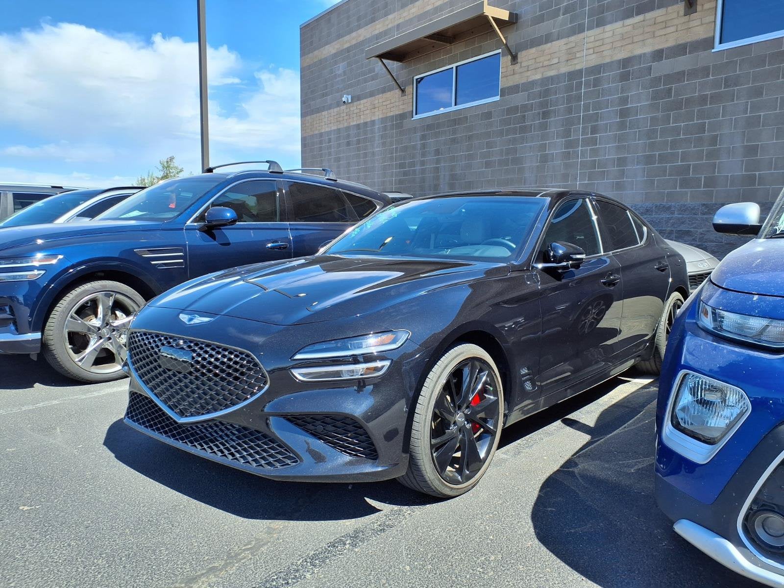 2023 Genesis G70 3.3T in Vik Black — front three-quarter view