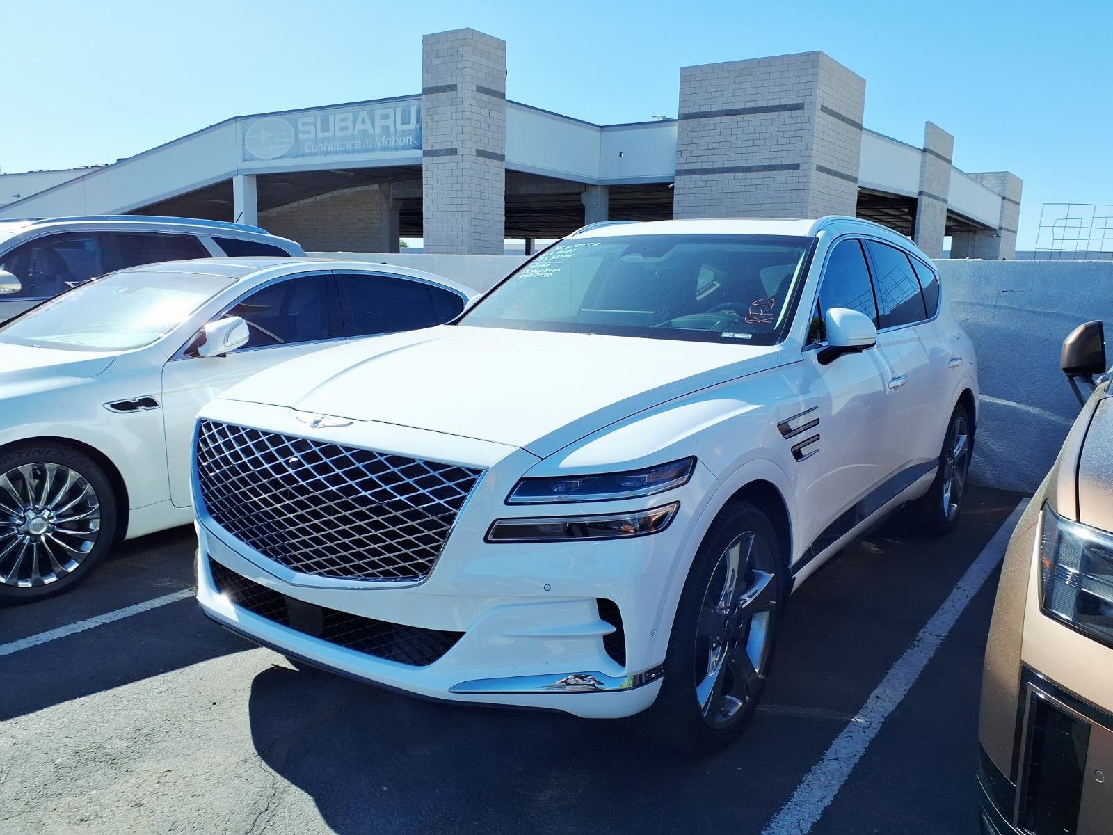 2023 Genesis GV80 3.5T AWD in Alta White — front three-quarter view