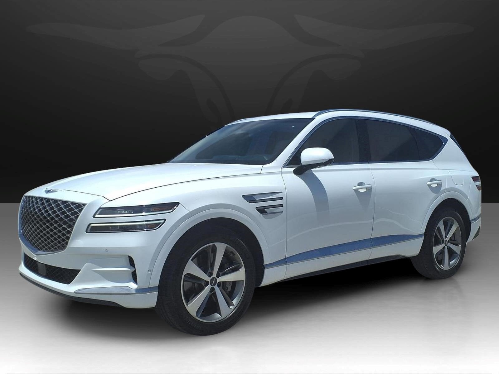 2023 Genesis GV80 Advanced + in Uyuni White — front three-quarter view