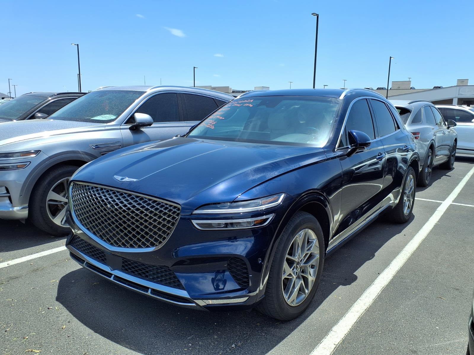 2022 Genesis GV70 2.5T in Adriatic Blue — front three-quarter view